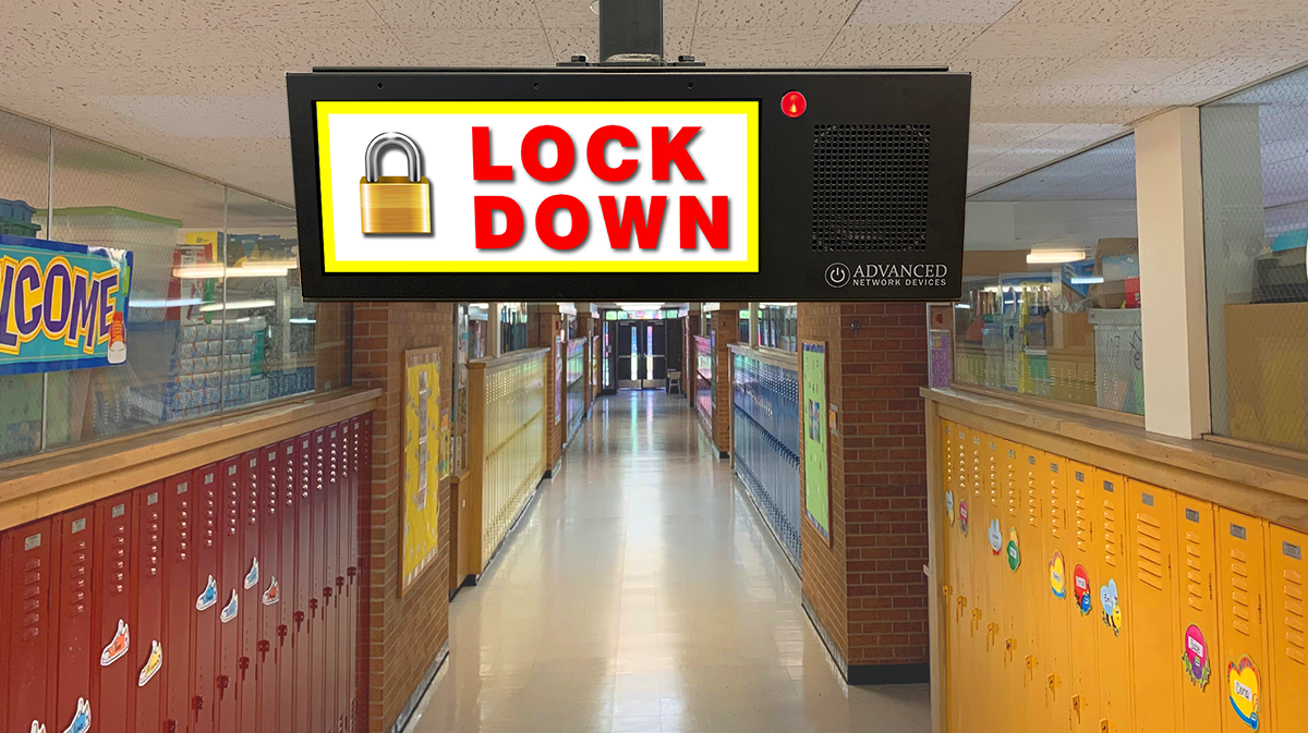 Double-Sided HD IP Display showing a Lockdown warning in a school hallway